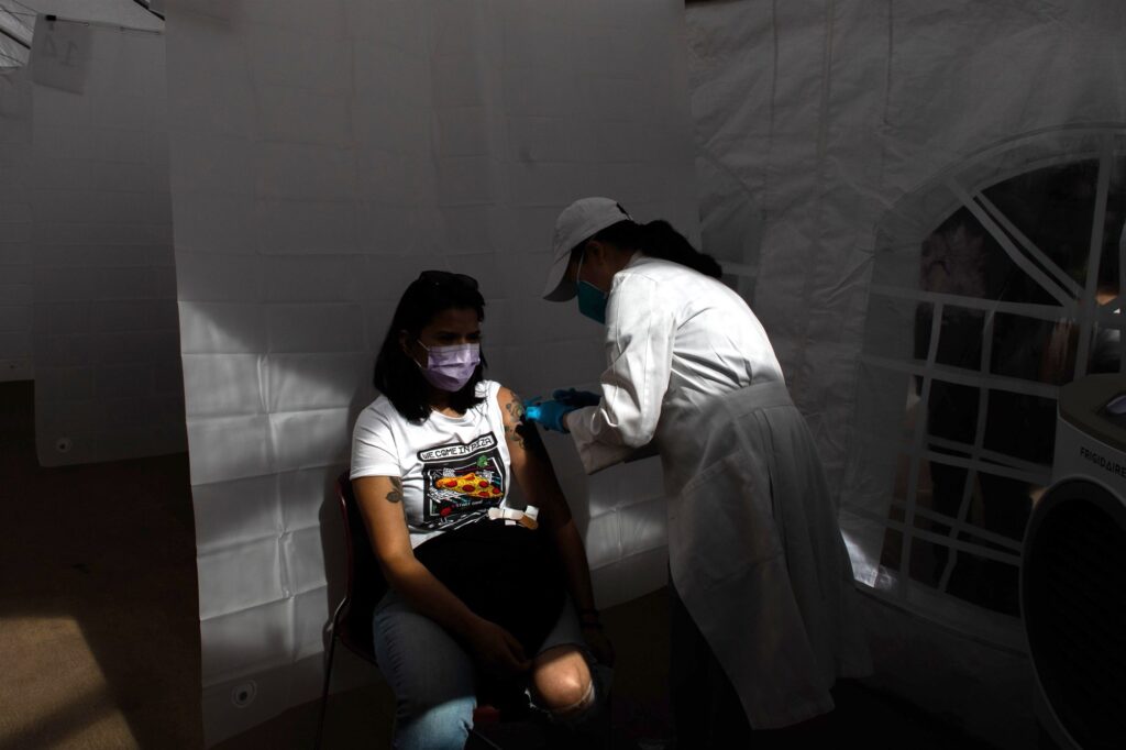 A nurse administers the Moderna Covid-19 vaccine at Kedren Community Health Center in Los Angeles on Feb. 16.